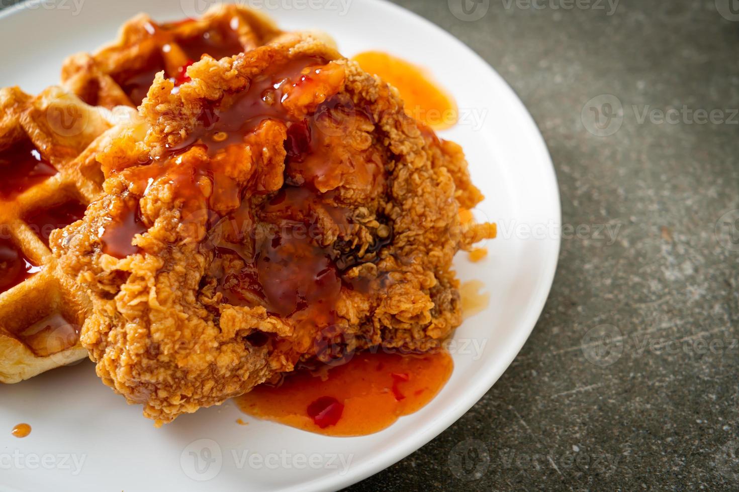 Homemade fried chicken with waffle and spicy sauce photo