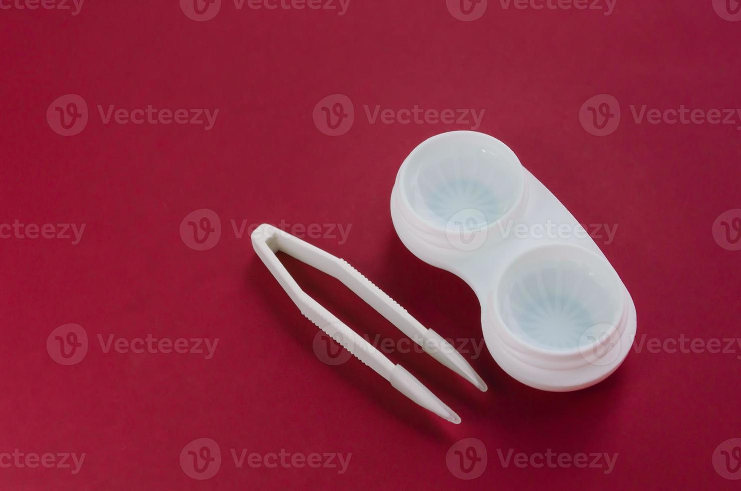 Contact lenses. Case for storage with tongs. photo