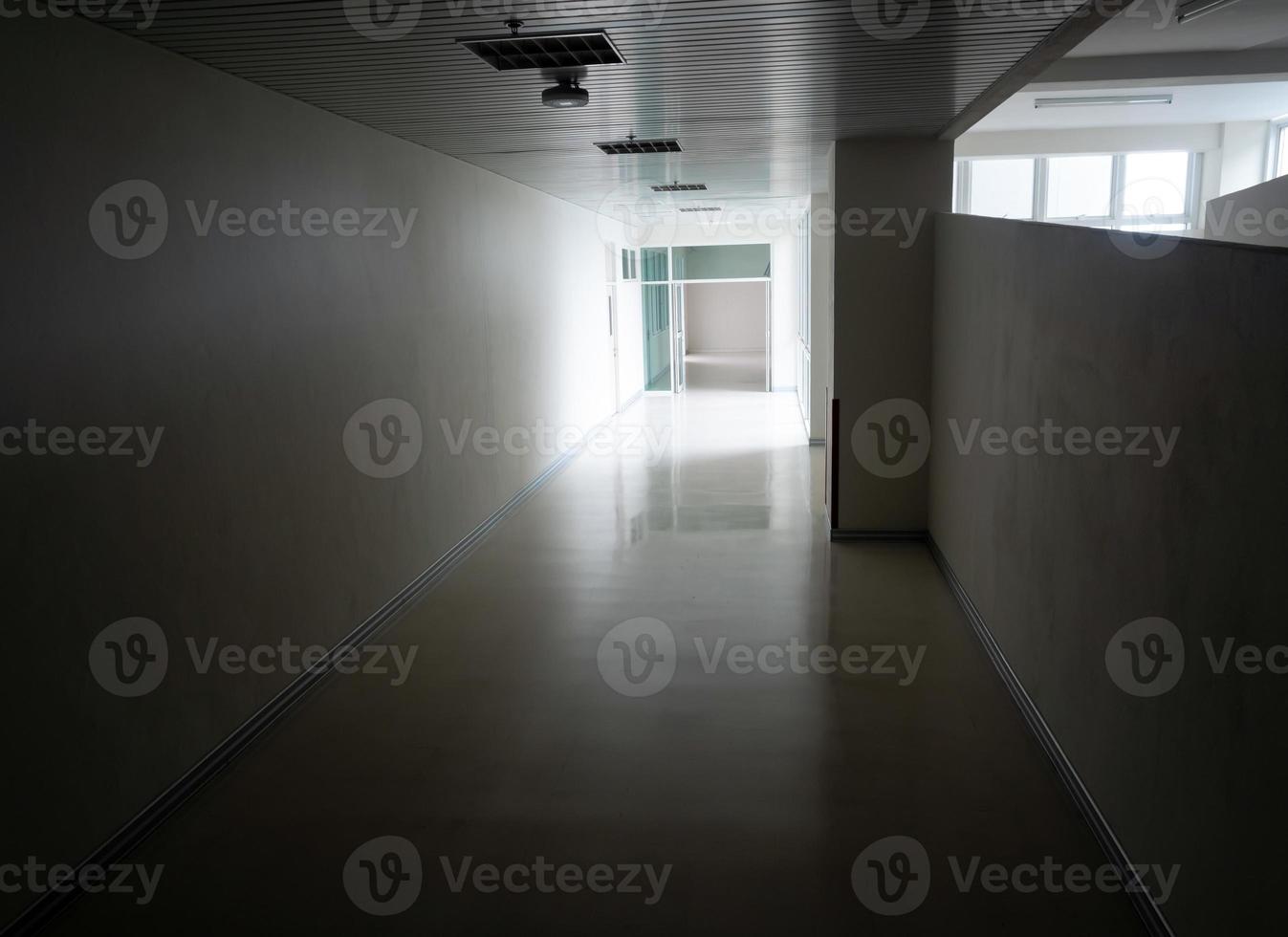 Light at the exit of the corridor in the building photo
