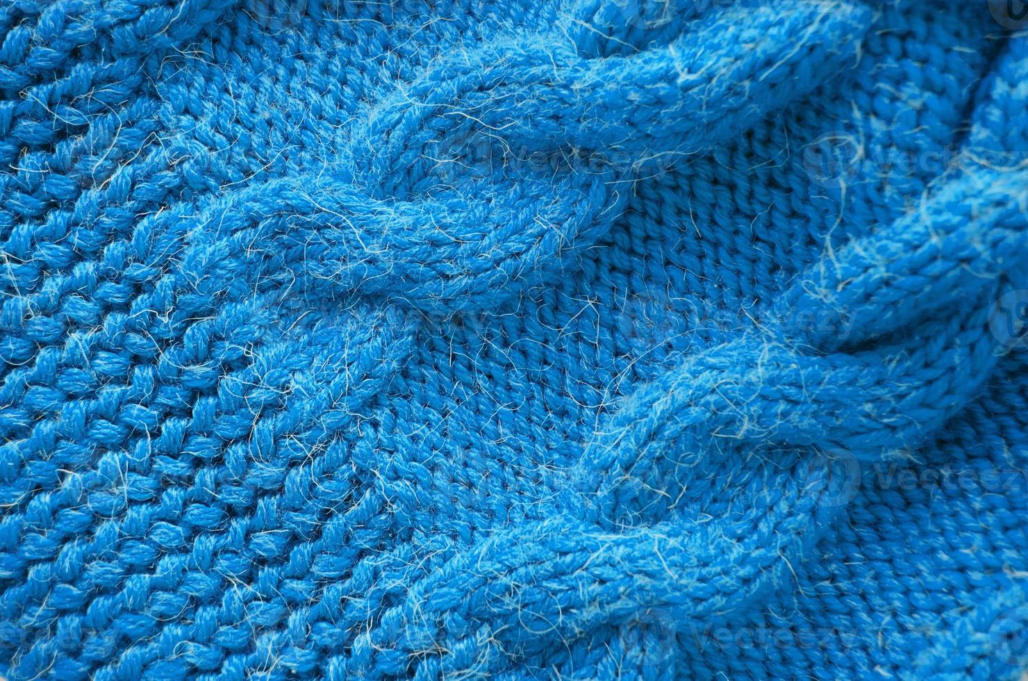 Knitted background. Knitted texture. Knitting pattern of wool. photo