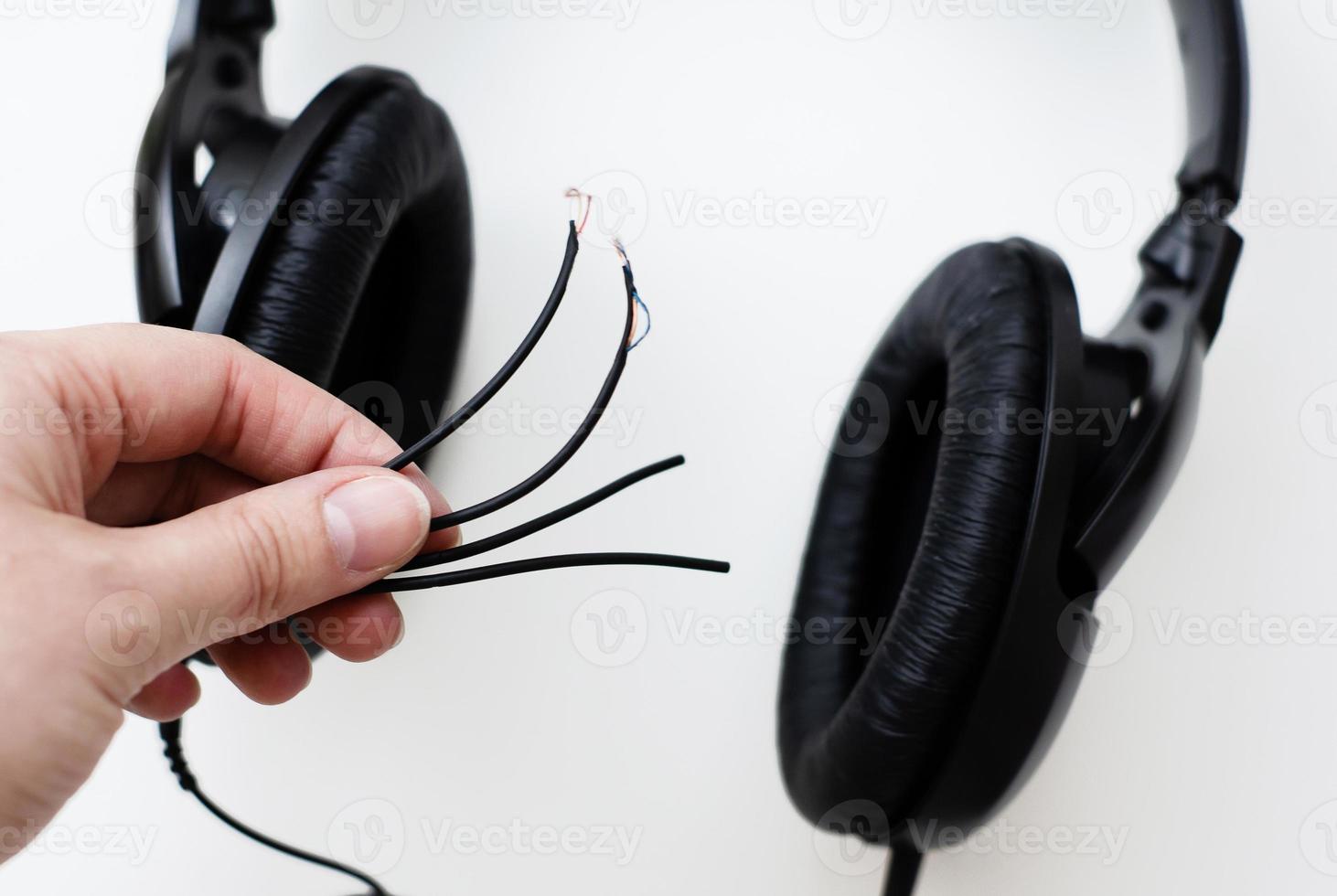 Broken headphones closeup. Broken wires. Photo. photo