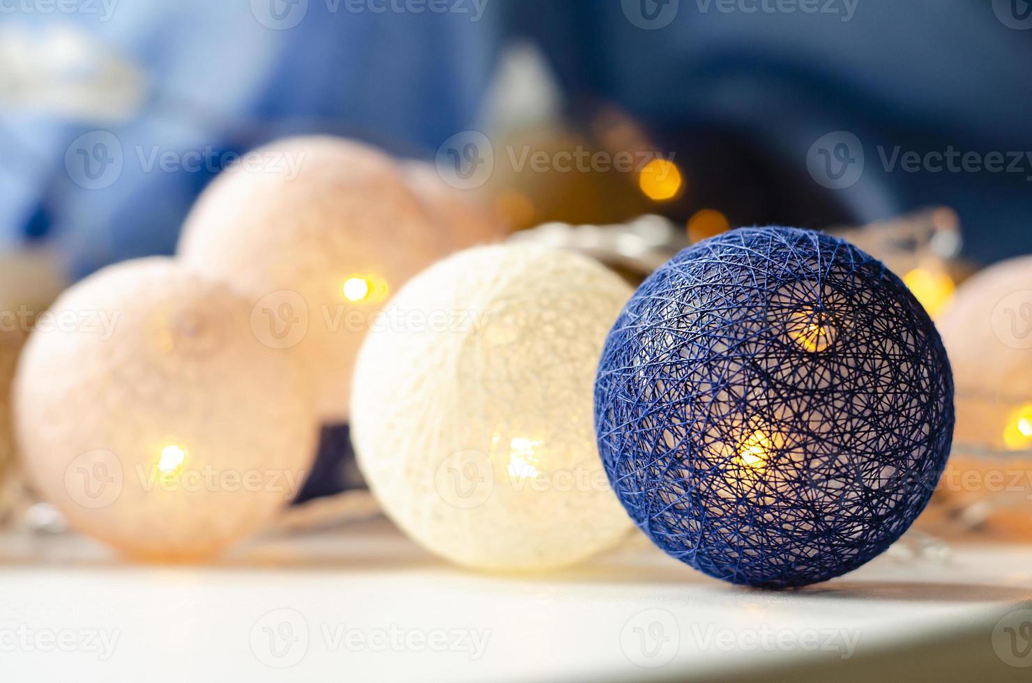 Christmas light garland. Wicker balls. Background. photo