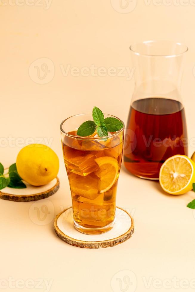 Glass of ice lemon tea with mint photo