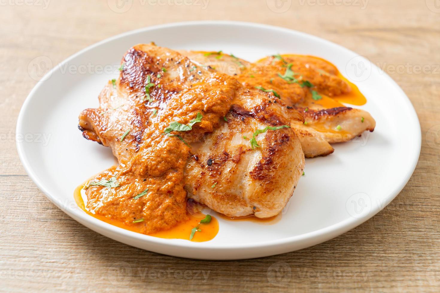 Grilled chicken steak with red curry sauce - Muslim food style photo