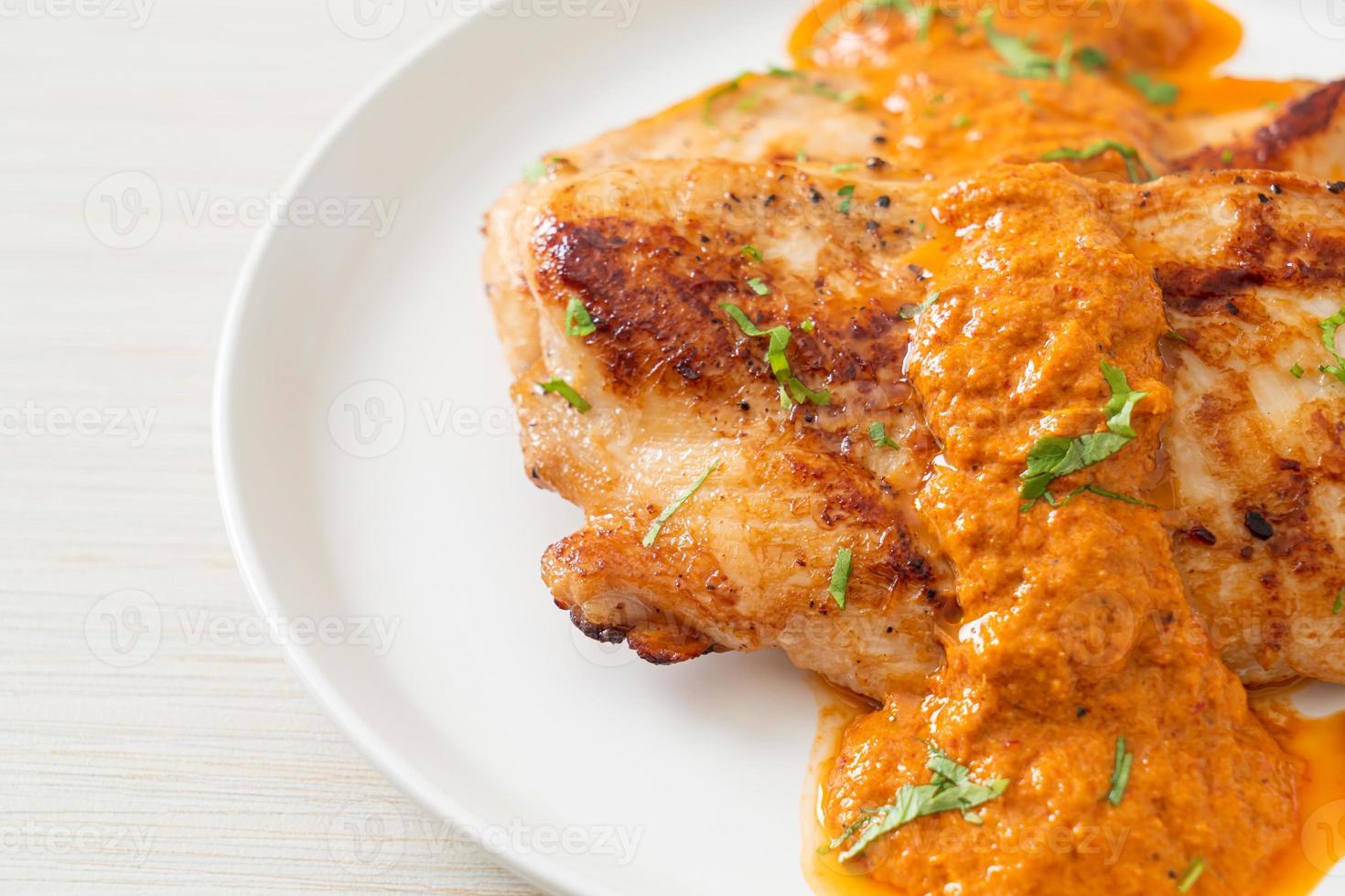Grilled chicken steak with red curry sauce - Muslim food style photo