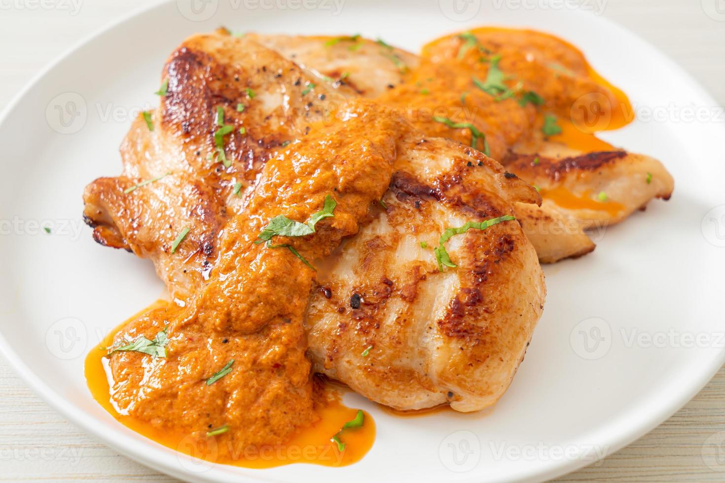 Grilled chicken steak with red curry sauce - Muslim food style photo