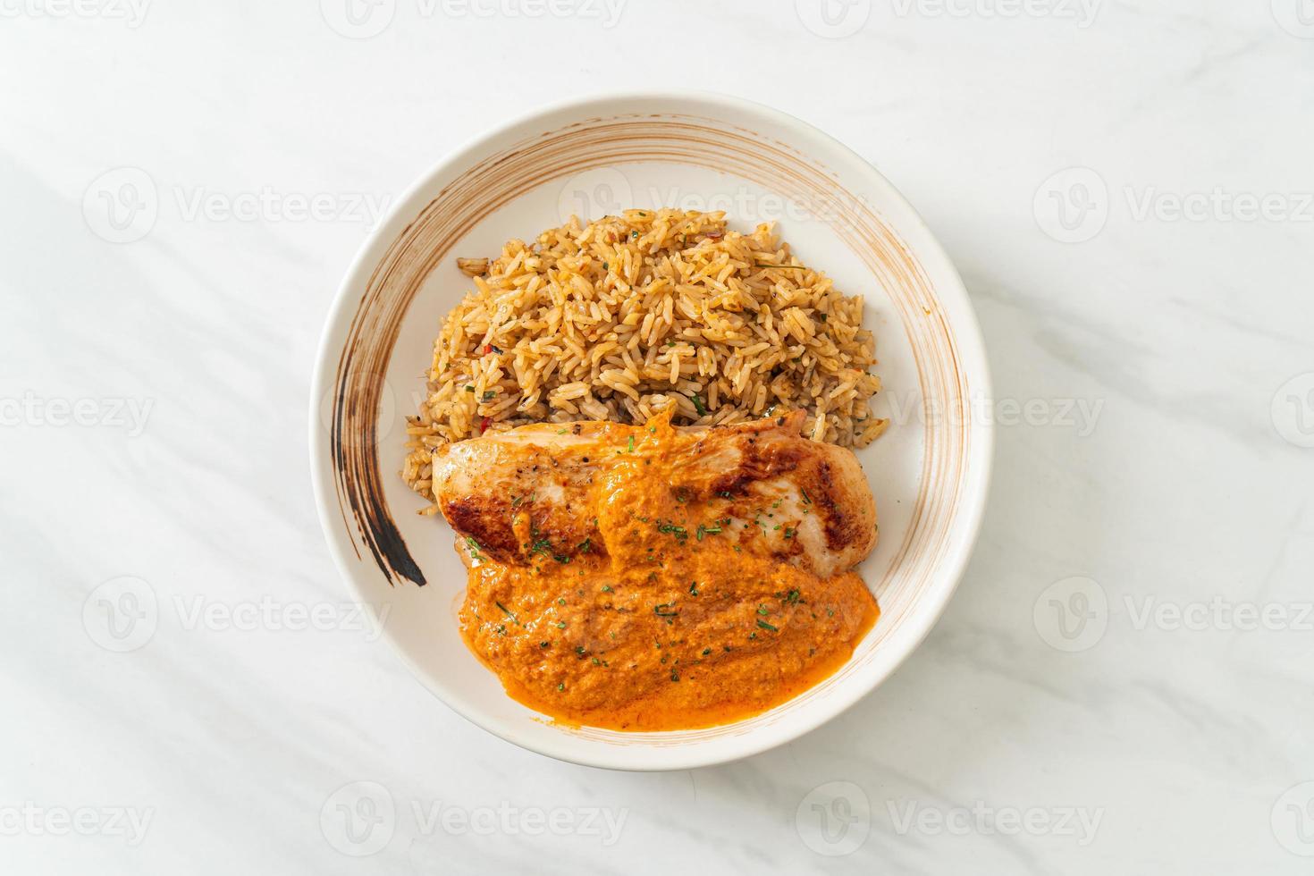 Grilled chicken steak with red curry sauce and rice - Muslim food style photo