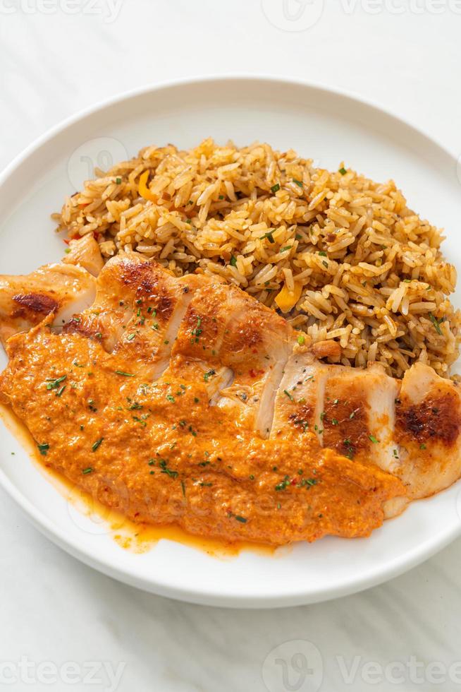 Grilled chicken steak with red curry sauce and rice - Muslim food style photo