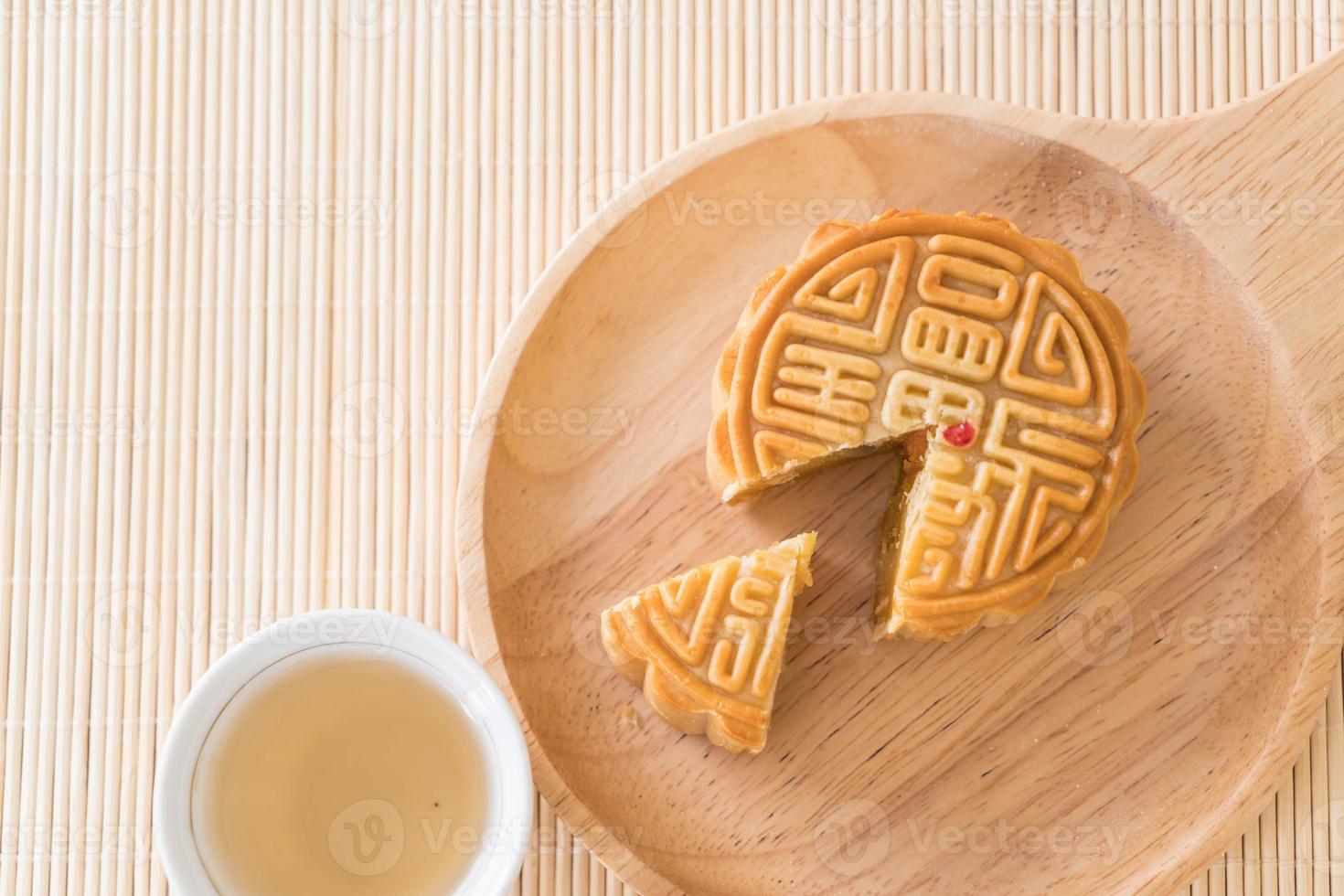 Fresh moon cake on wood plate photo