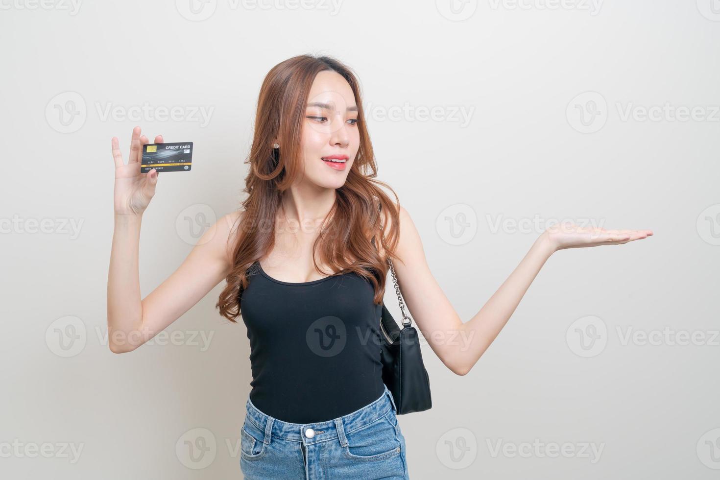 Portrait beautiful Asian woman holding credit card on white background photo
