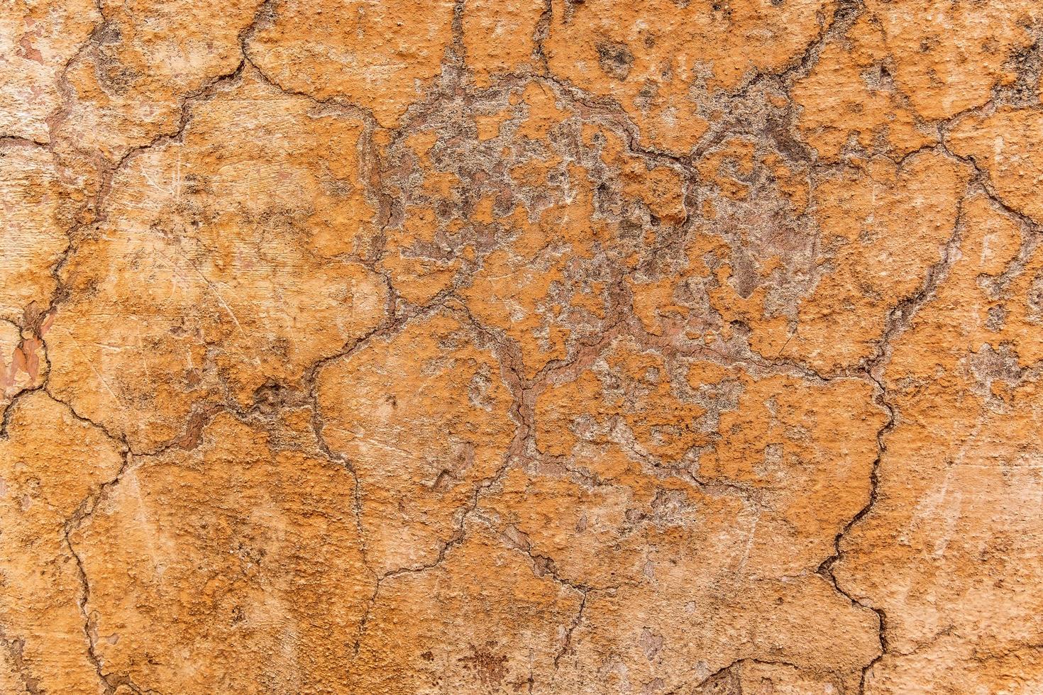 Brown adobe clay wall texture background. photo