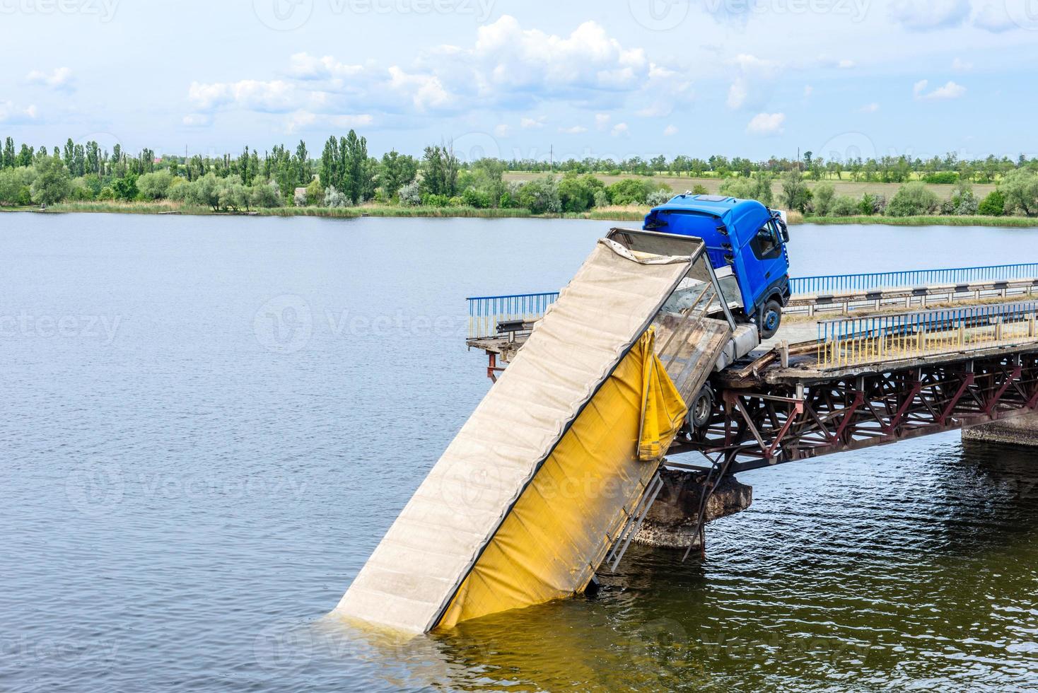 Destruction of bridge structures across the river photo
