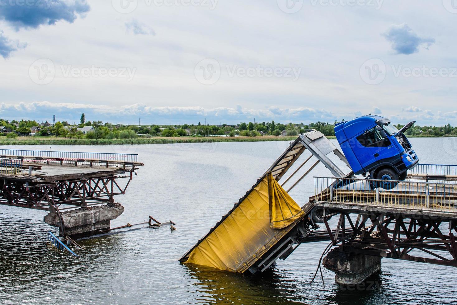 Destruction of bridge structures across the river photo