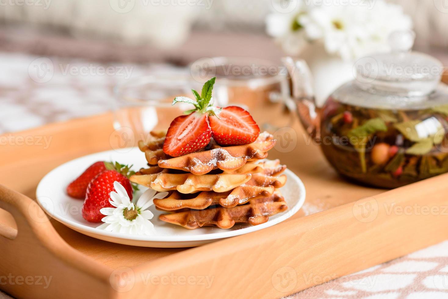 Delicious fresh baked belgian waffles with berries and fruit photo