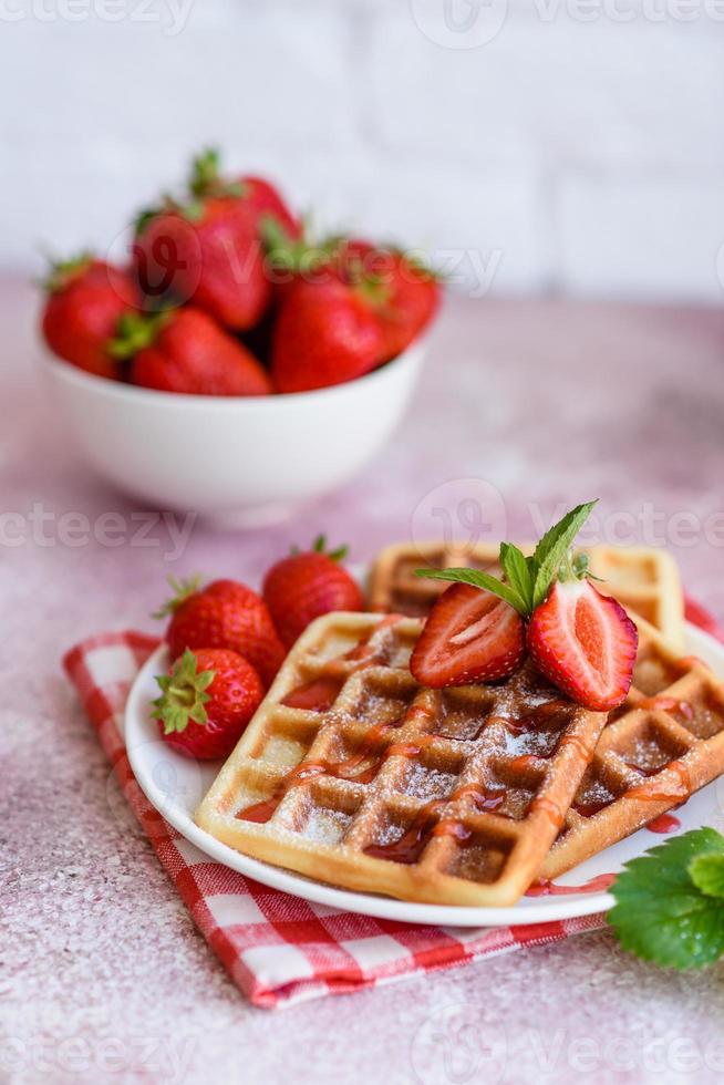 Delicious fresh baked belgian waffles with berries and fruit photo