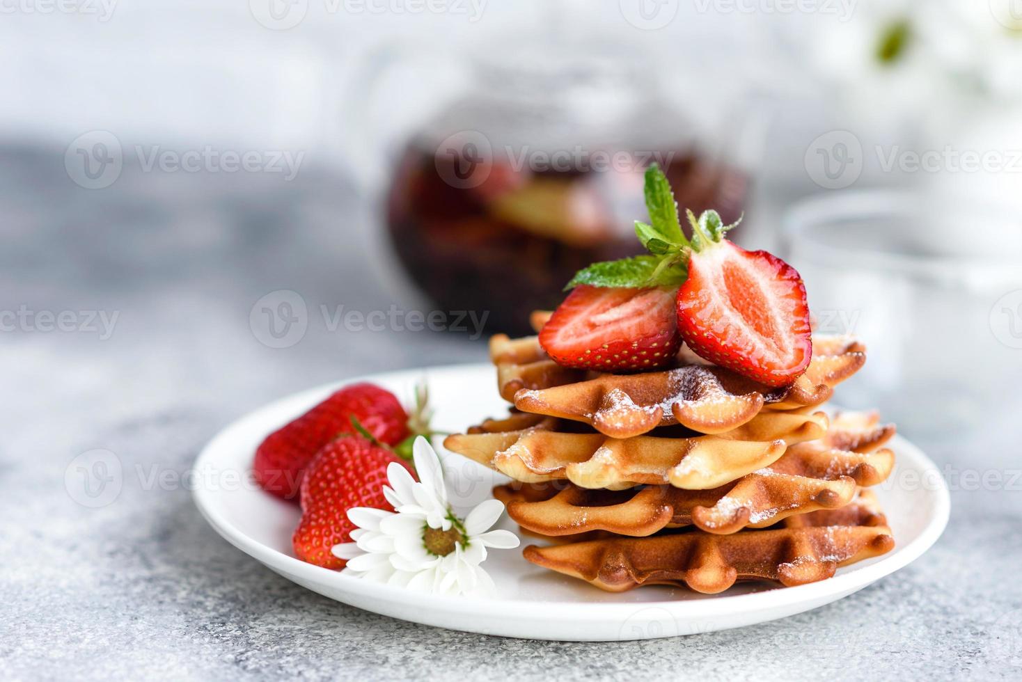 Delicious fresh baked belgian waffles with berries and fruit photo
