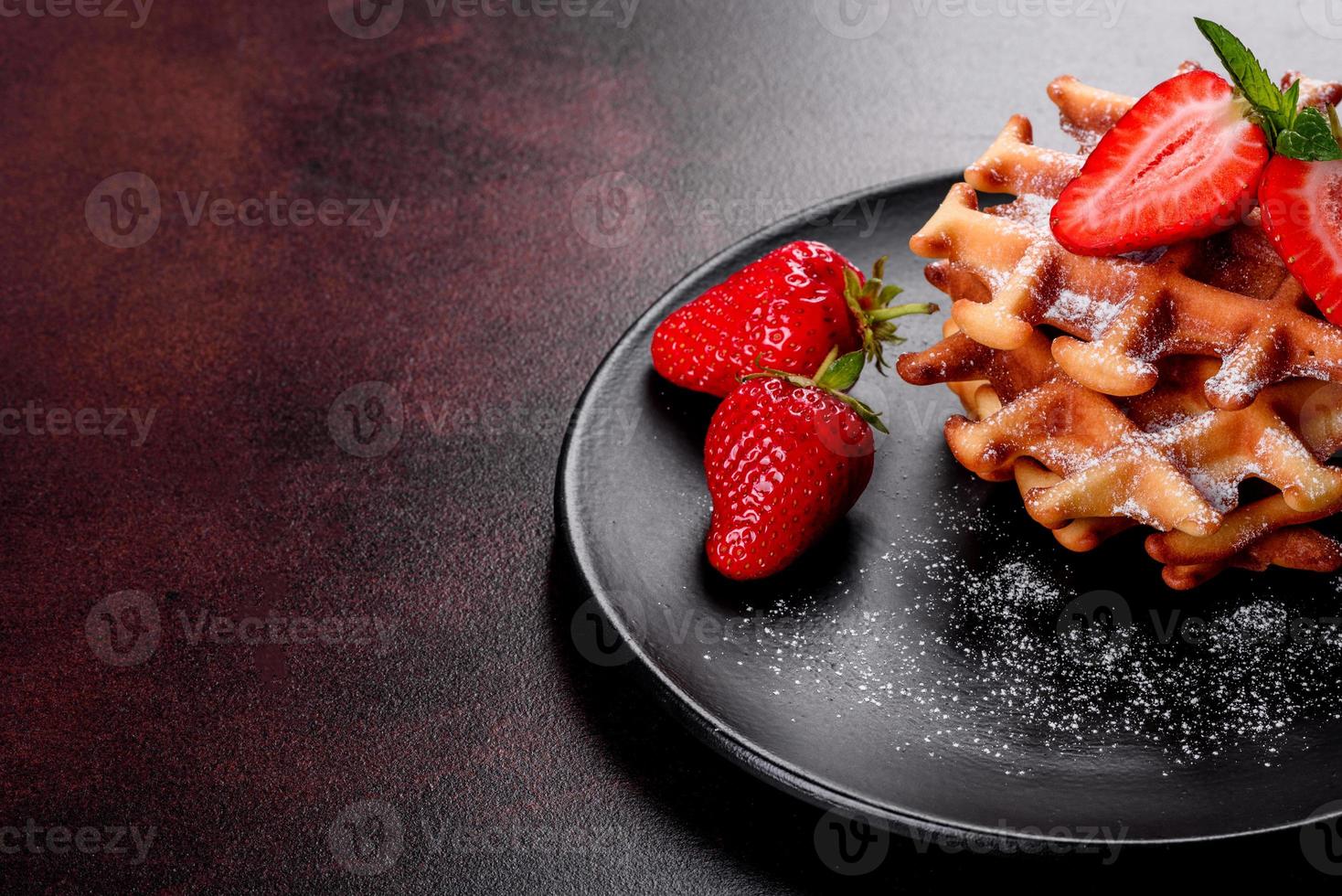 Delicious fresh baked belgian waffles with berries and fruit photo