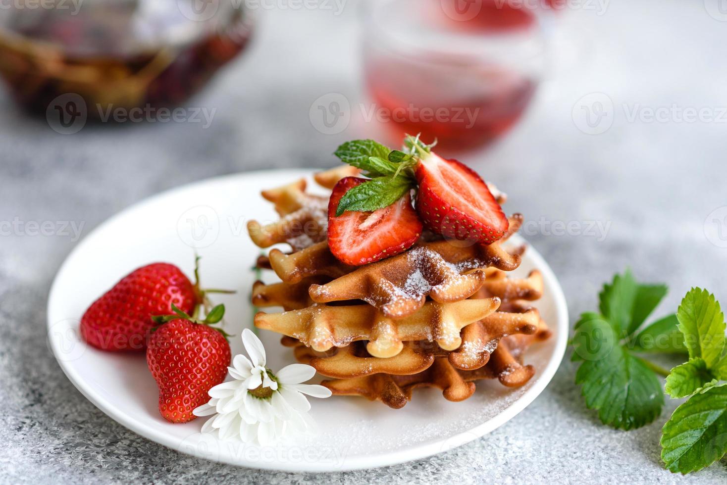 Delicious fresh baked belgian waffles with berries and fruit photo