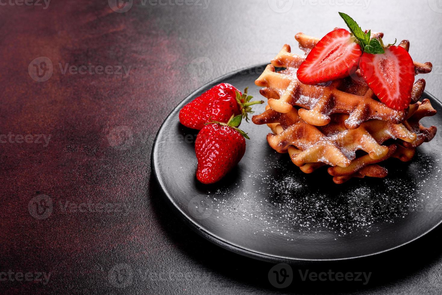 Delicious fresh baked belgian waffles with berries and fruit photo