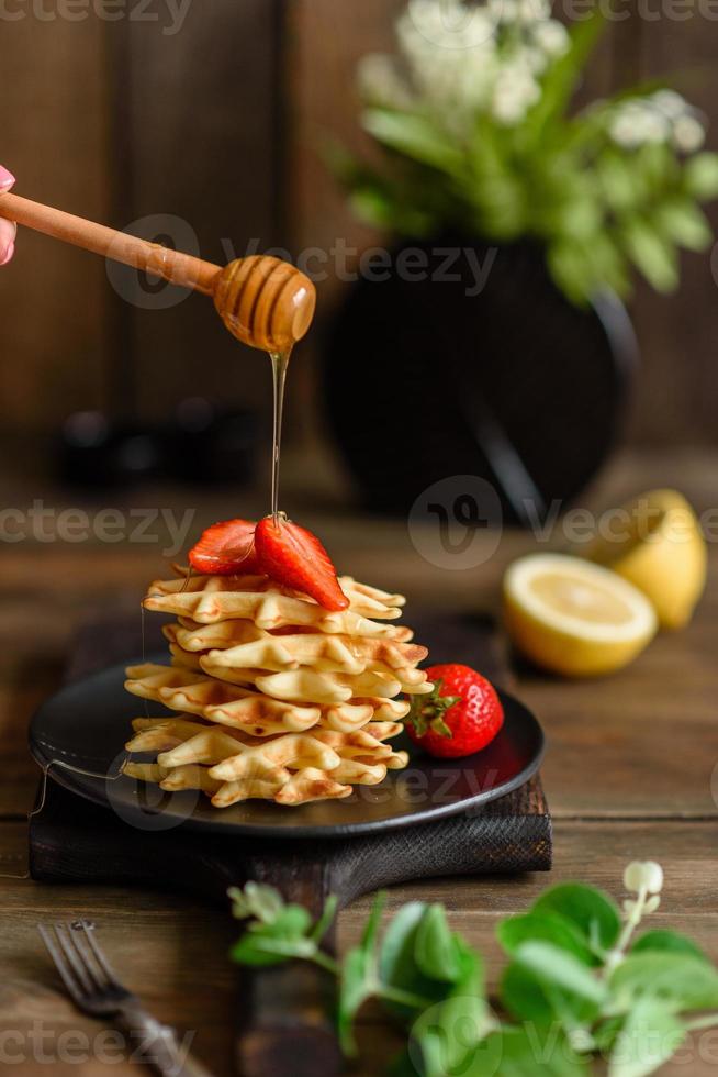 Delicious fresh baked belgian waffles with berries photo