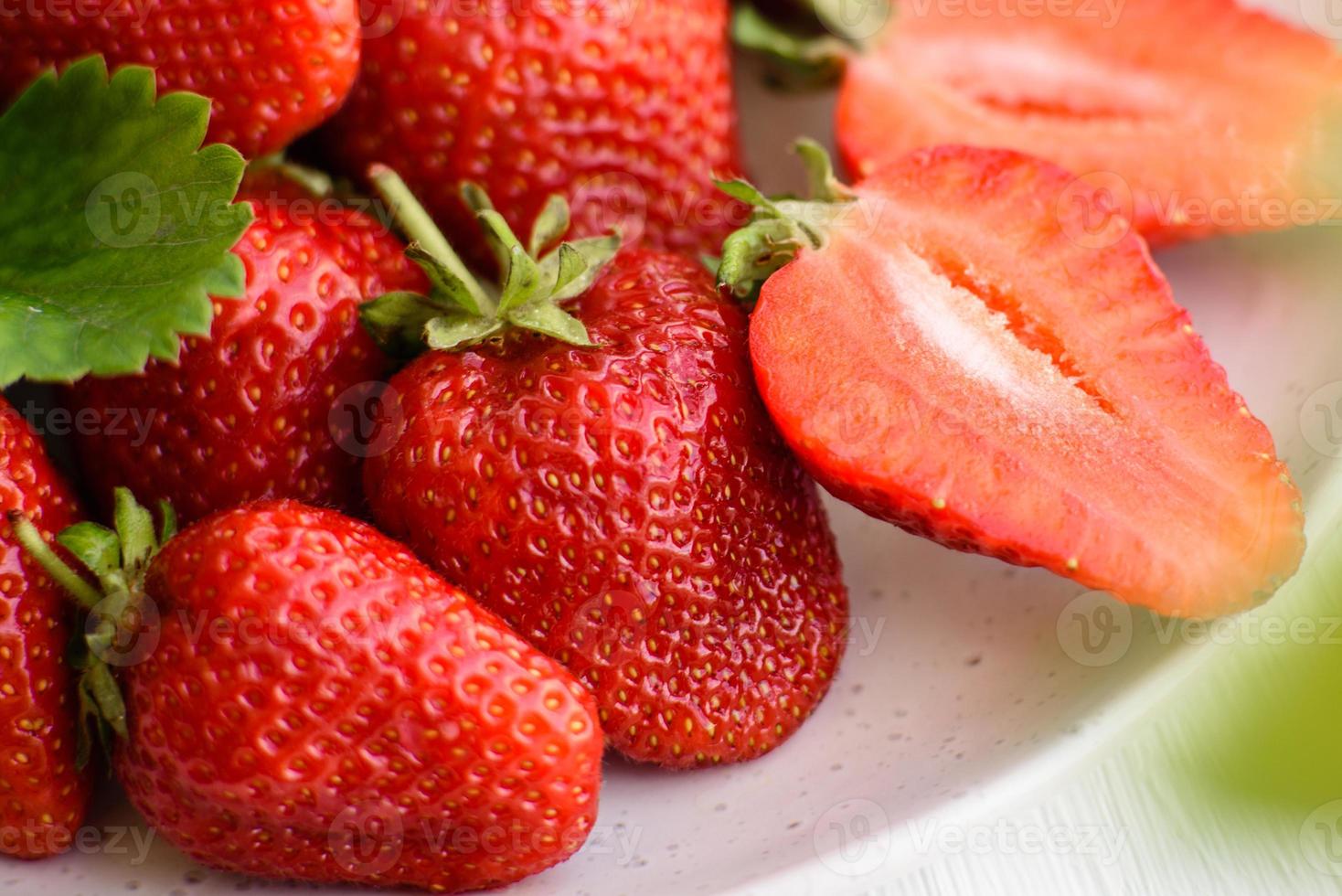 Beautiful juicy fresh strawberries on the concrete surface photo