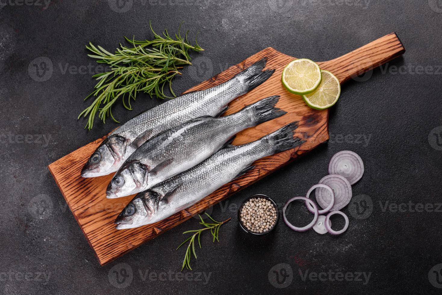 Fresh fish seabass and ingredients for cooking. Raw fish seabass photo