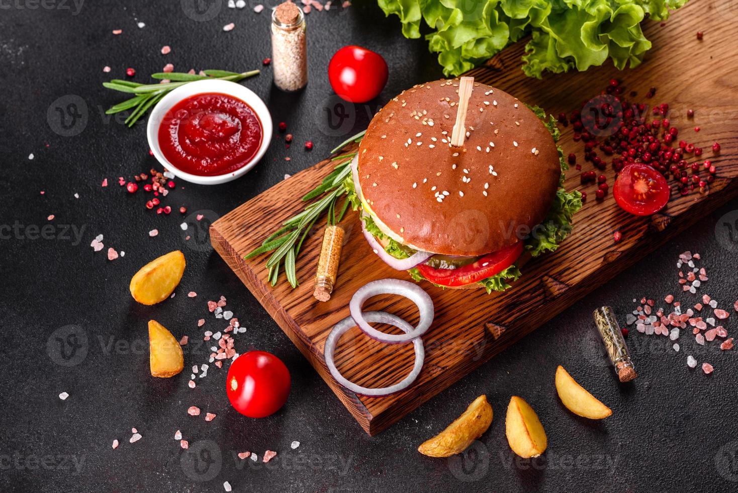 Delicious fresh homemade burger on a wooden table photo