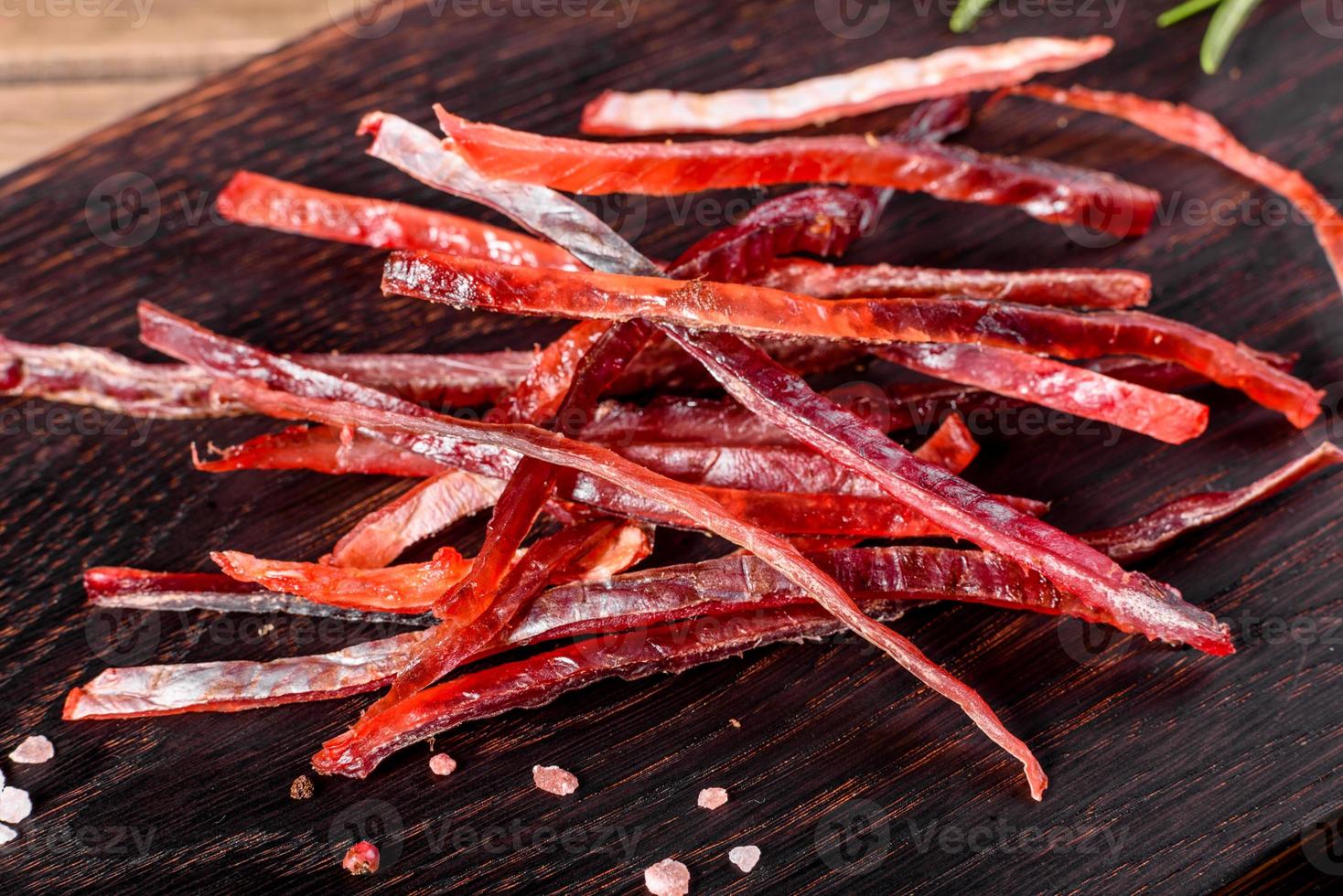 Salted smoked fish sliced with slices for snack to beer photo