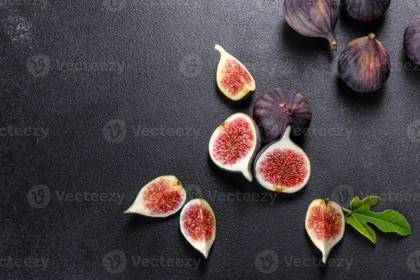 Fresh ripe figs on a dark concrete background. Harvesting figs photo