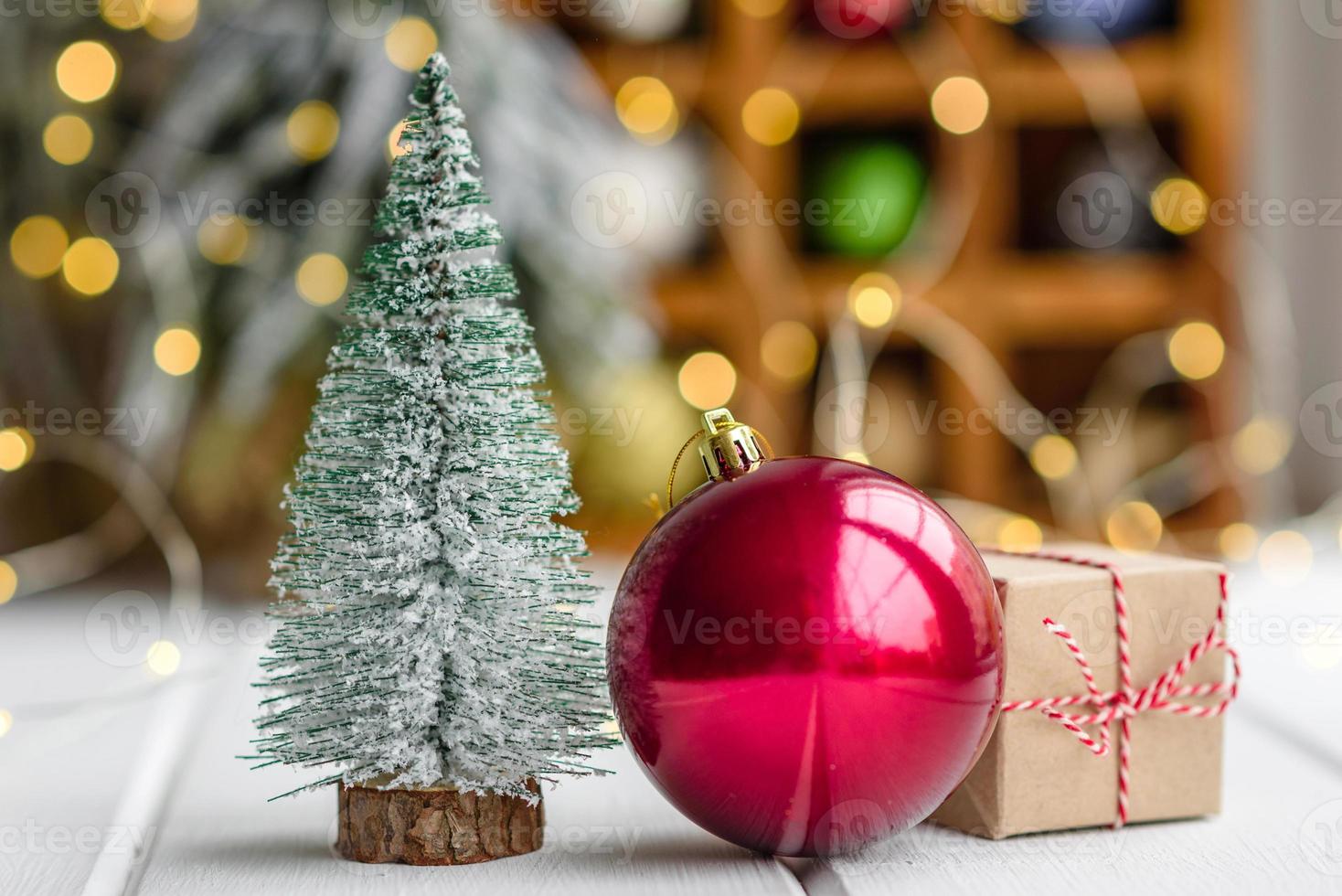 Beautiful multi-colored Christmas decorations on a light wooden table photo