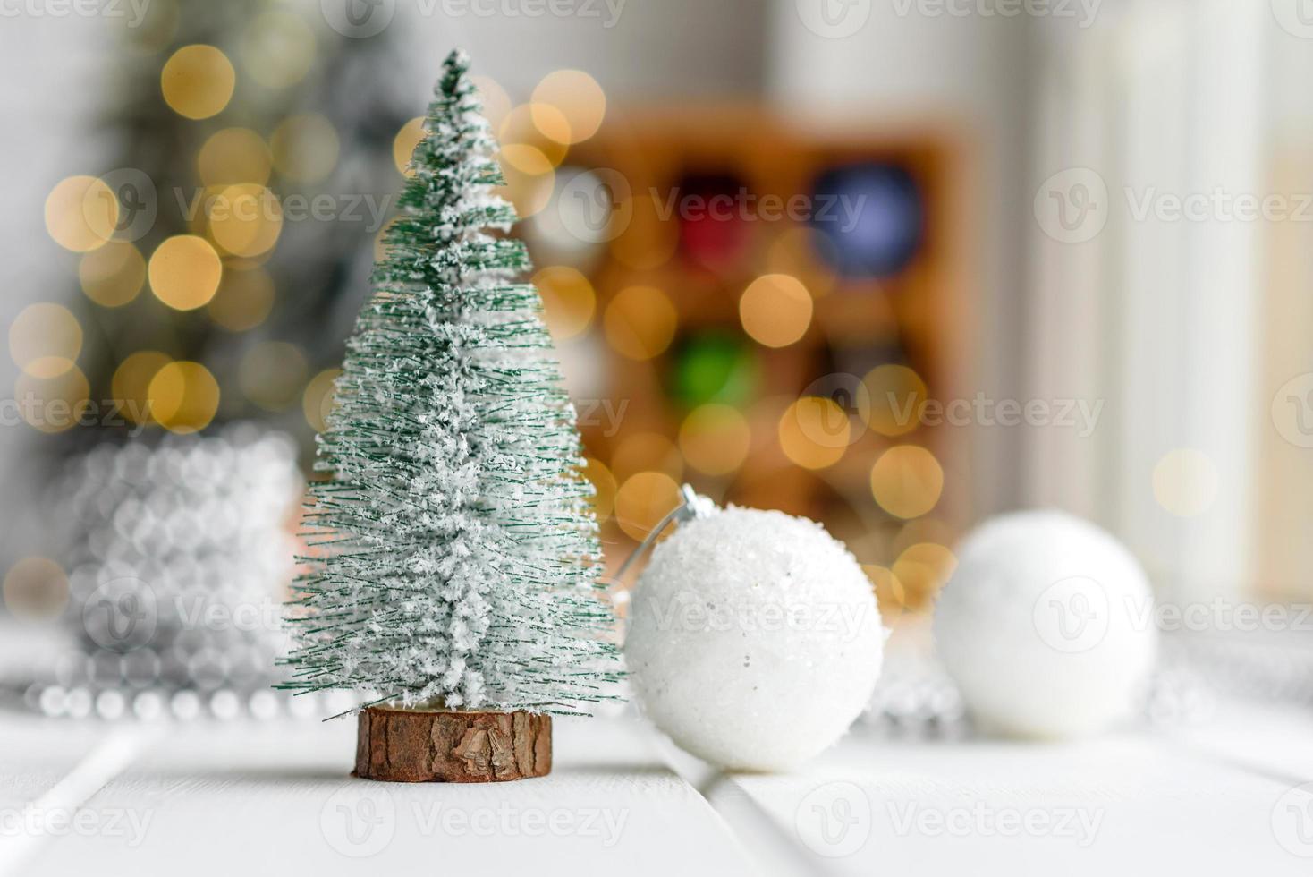 Beautiful multi-colored Christmas decorations on a light wooden table photo