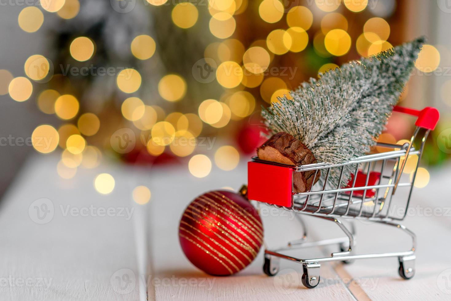 Shopping cart with Christmas gifts and presents. Christmas shopping photo
