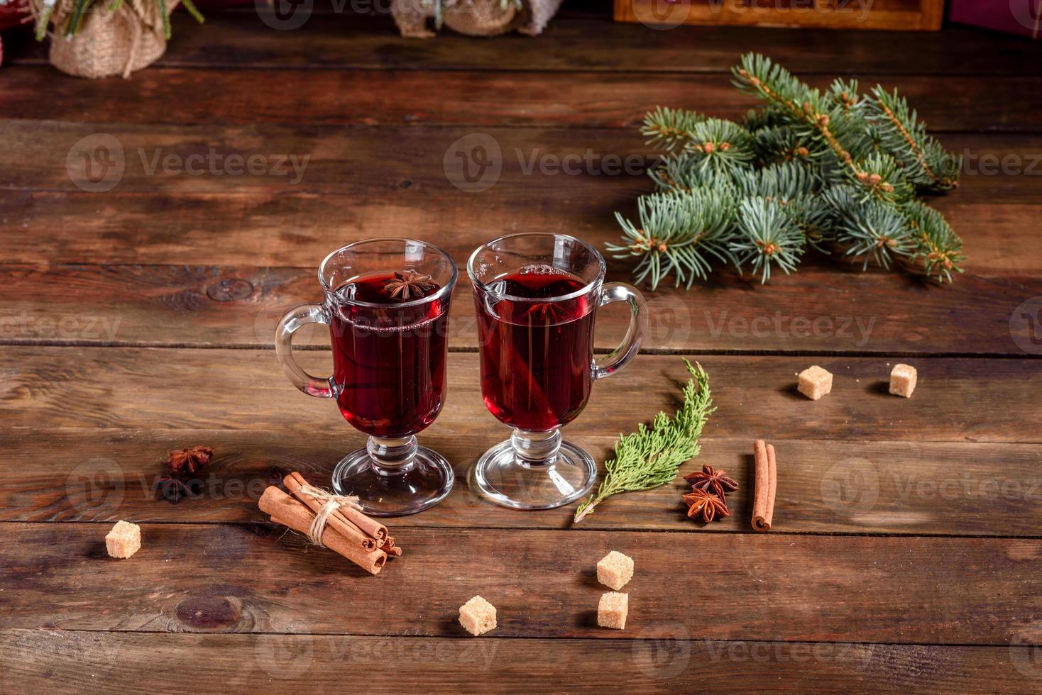 Hot mulled wine for winter and Christmas with various spices photo