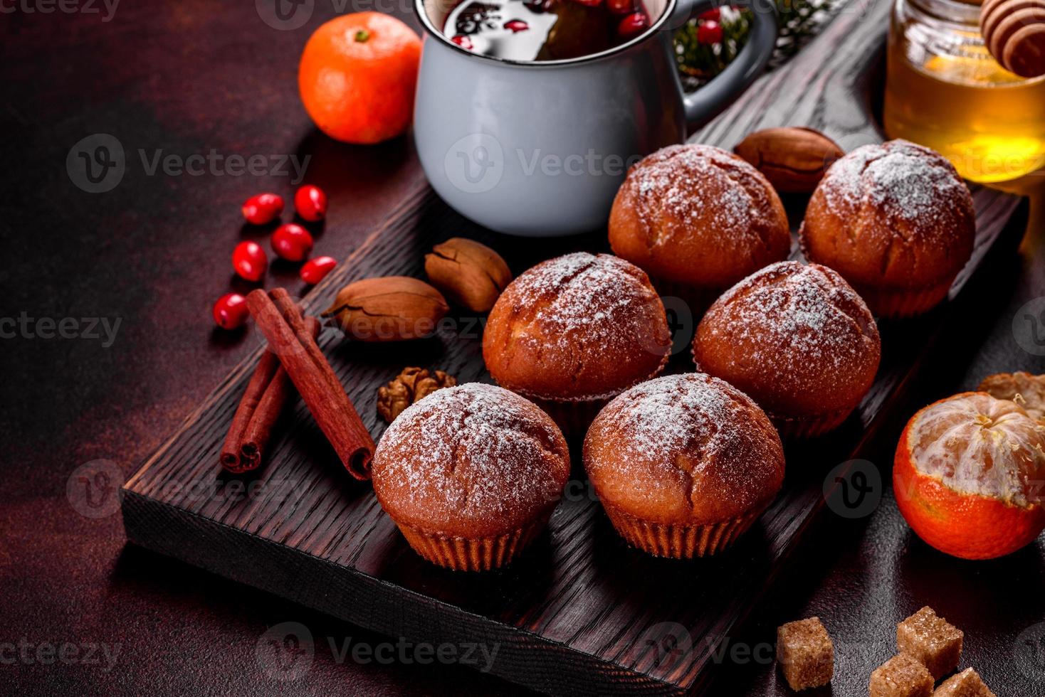 Beautiful delicious fresh cocoa muffins on the Christmas table photo