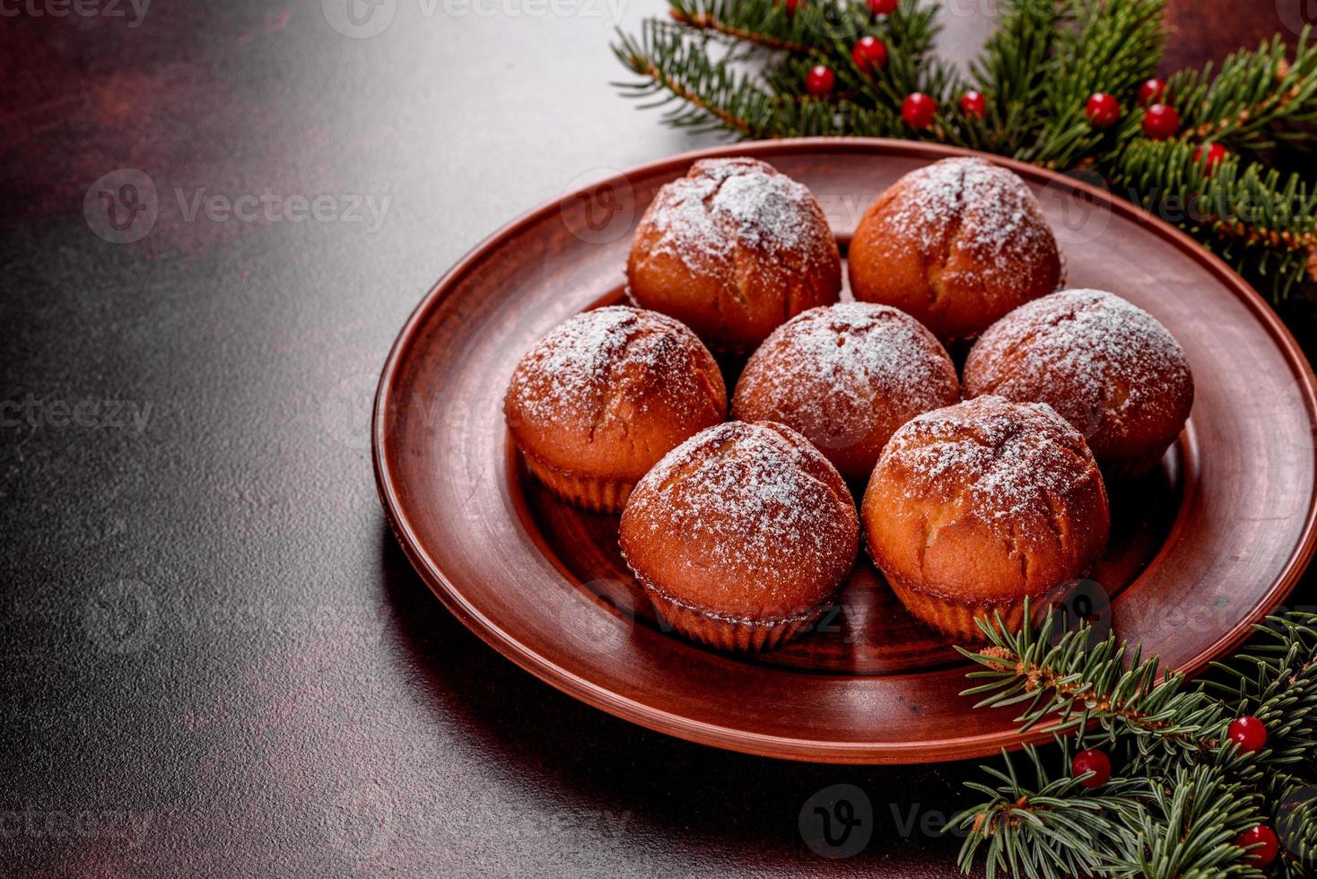 Beautiful delicious fresh cocoa muffins on the Christmas table photo