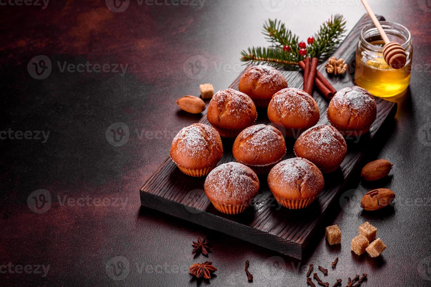 Beautiful delicious fresh cocoa muffins on the Christmas table photo