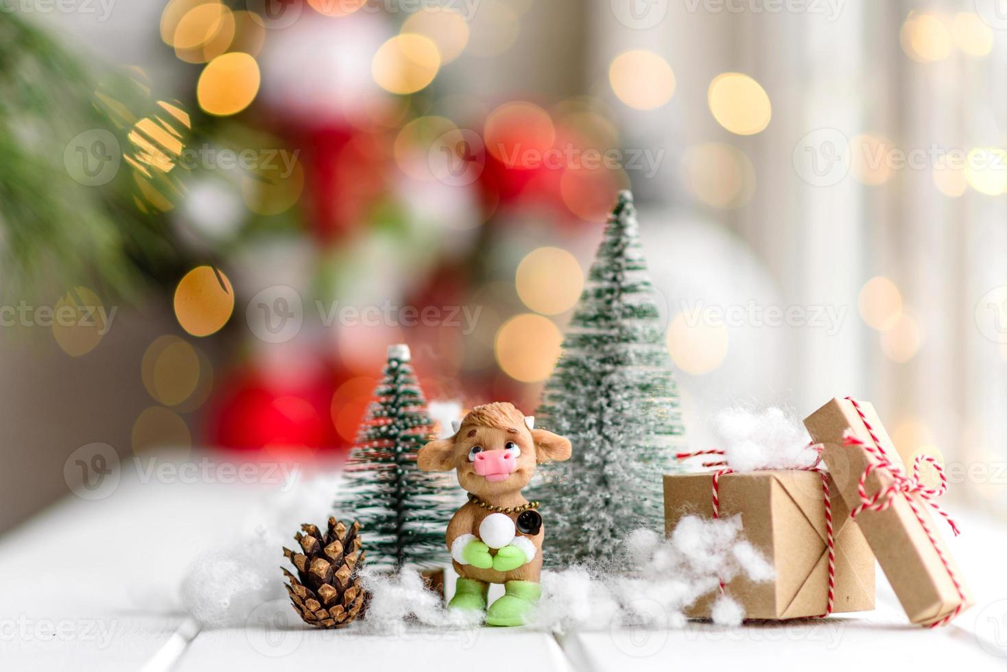 Beautiful multi-colored Christmas decorations on a light wooden table photo