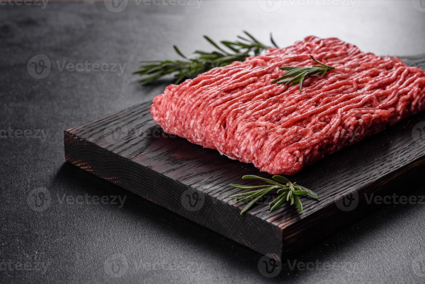 Fresh raw beef mince on a dark background photo