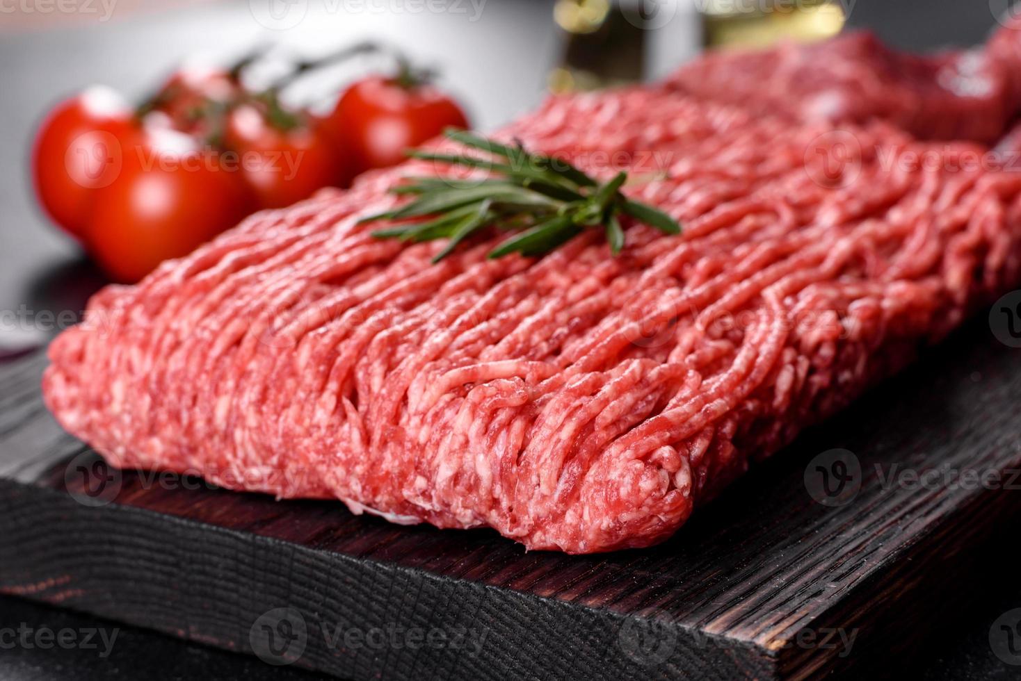 Fresh raw beef mince on a dark background photo