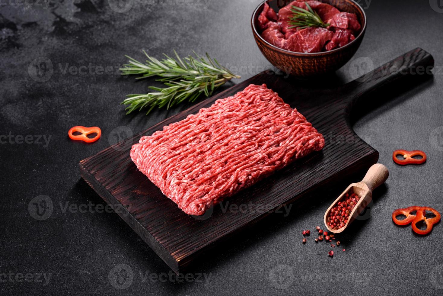 Fresh raw beef mince on a dark background photo