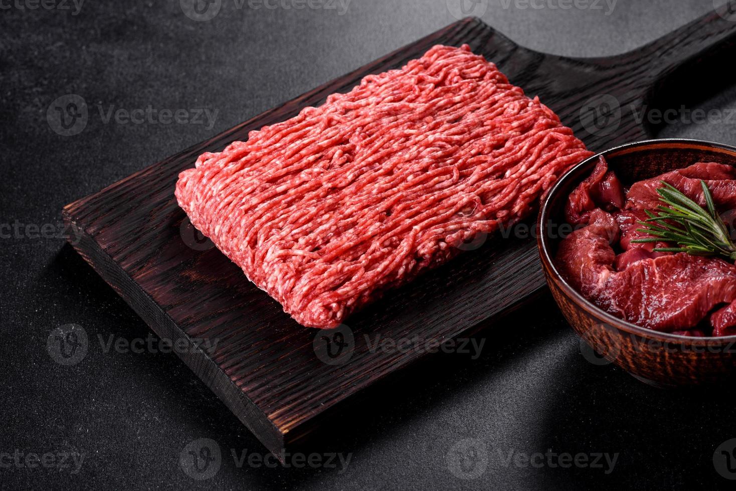 Fresh raw beef mince on a dark background photo