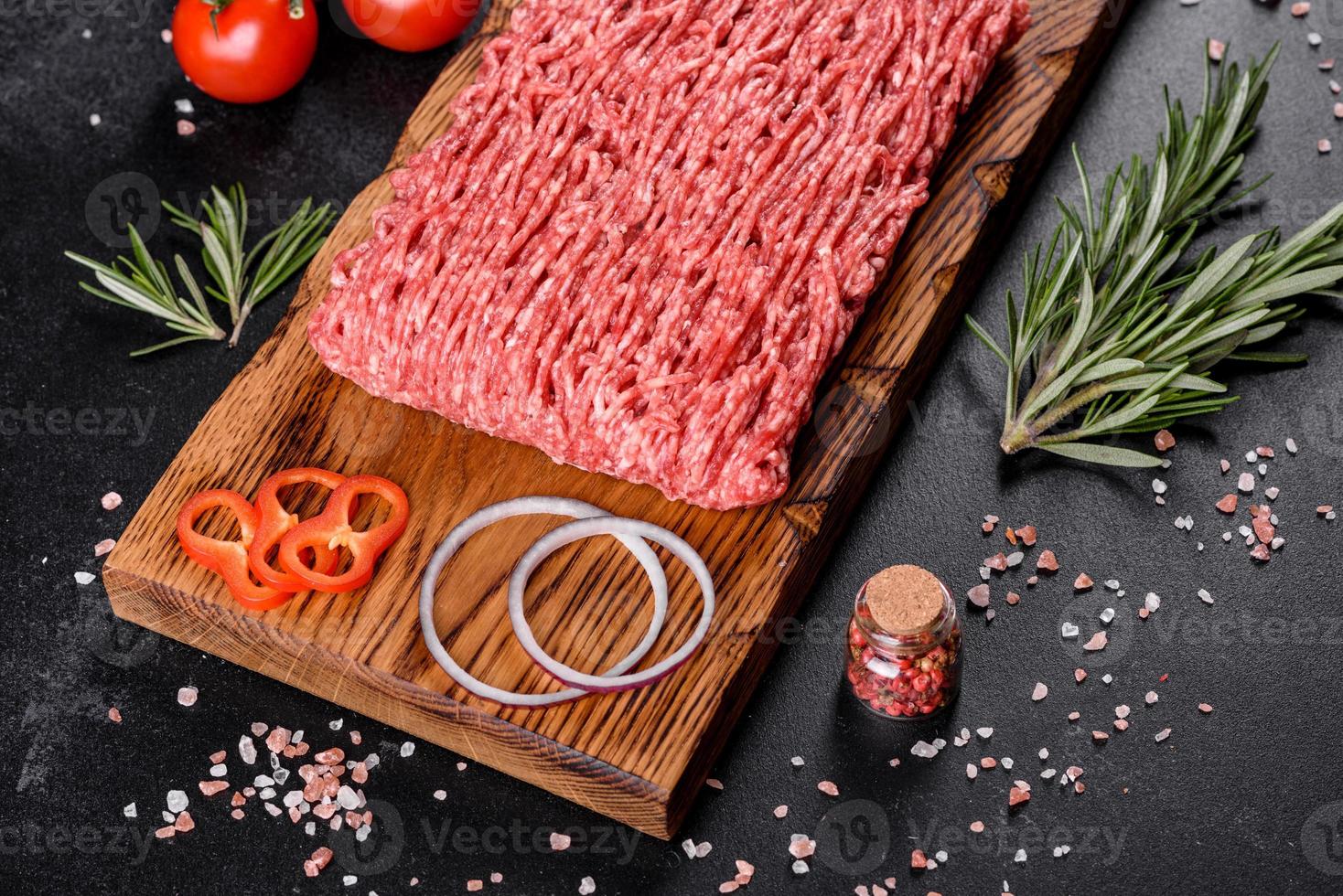 Fresh raw beef mince on a dark background photo