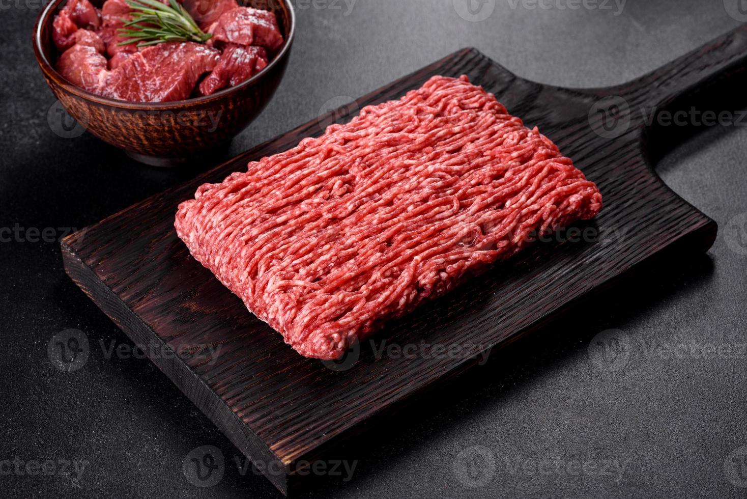 Fresh raw beef mince on a dark background photo