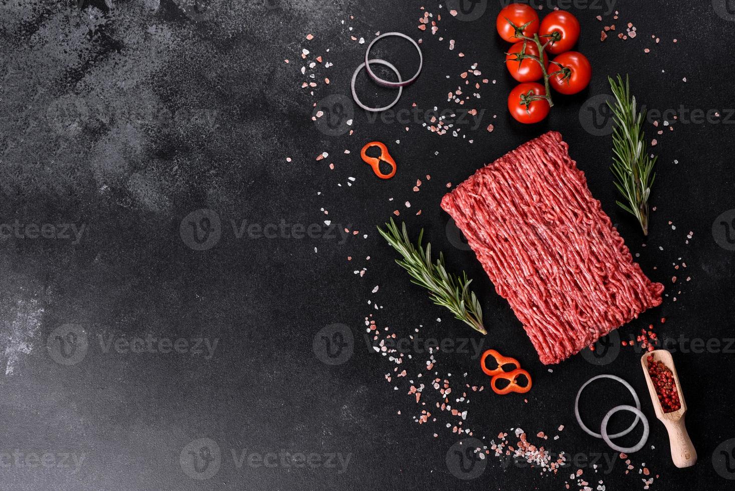 Fresh raw beef mince on a dark background photo