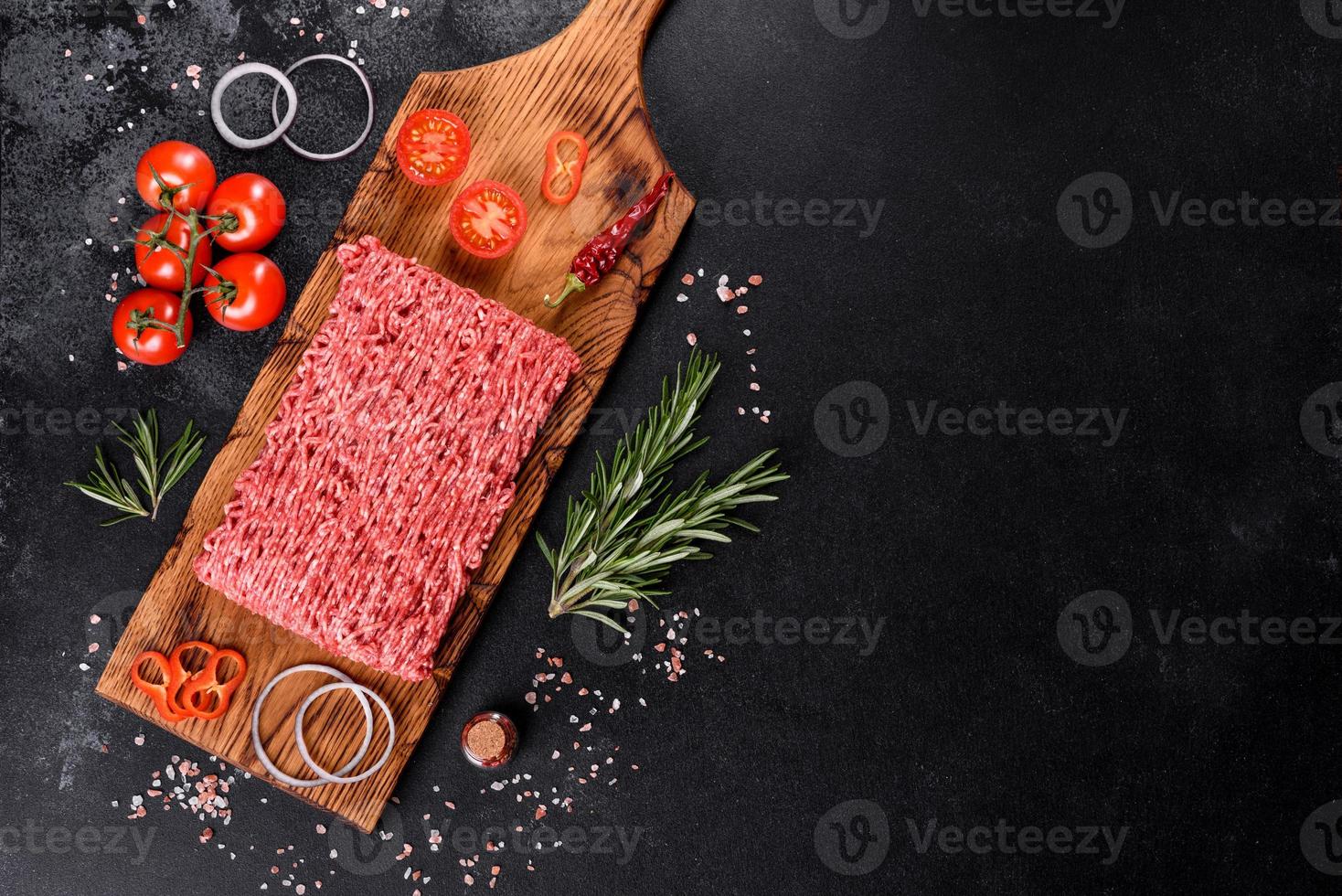 Fresh raw beef mince on a dark background photo