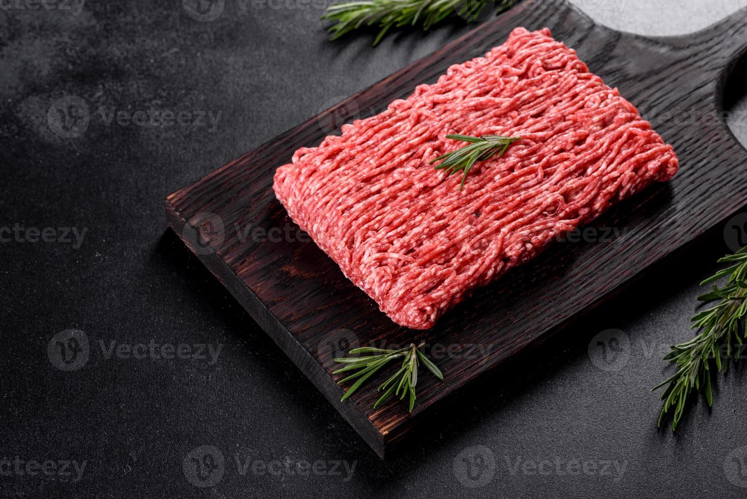 Fresh raw beef mince on a dark background photo