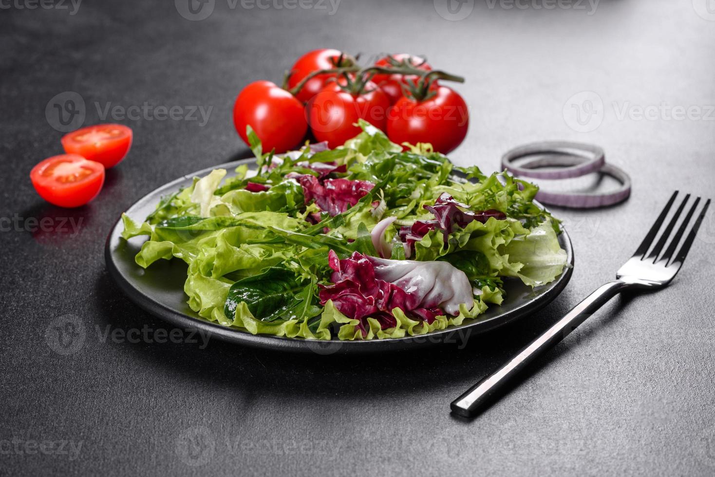 Fresh delicious vegitarian salad of chopped vegetables on a plate photo