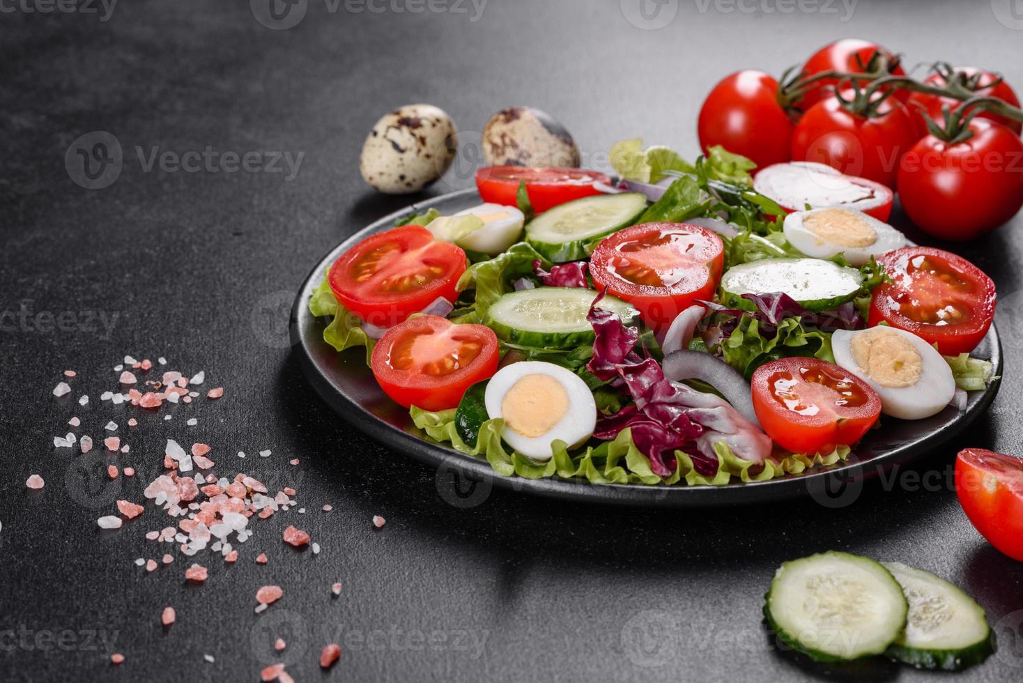 Fresh delicious vegitarian salad of chopped vegetables on a plate photo