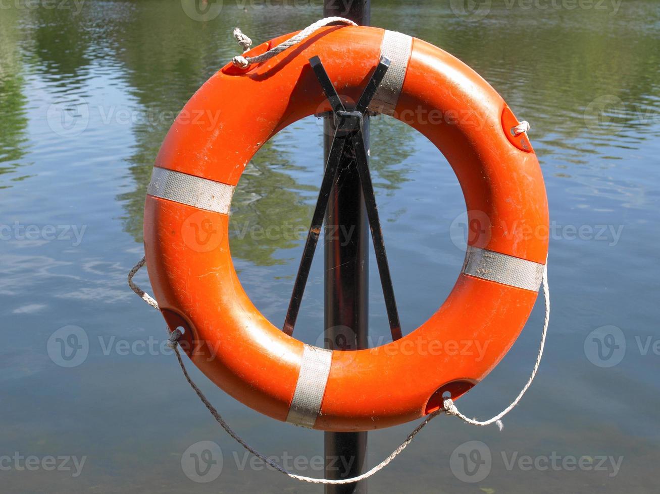 Life buoy at water side photo