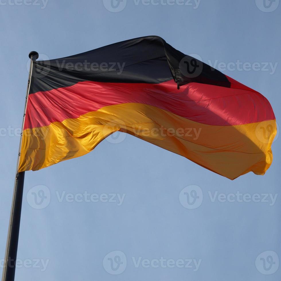 German flag over blue sky photo